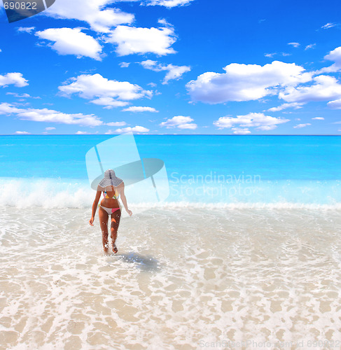 Image of Woman enjoying the sea