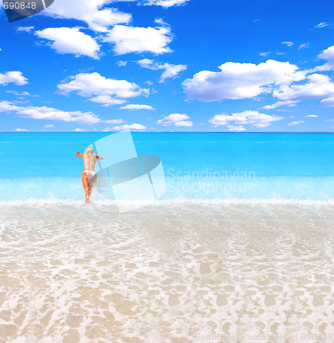 Image of Woman enjoying the sea
