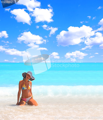 Image of Woman enjoying the sea