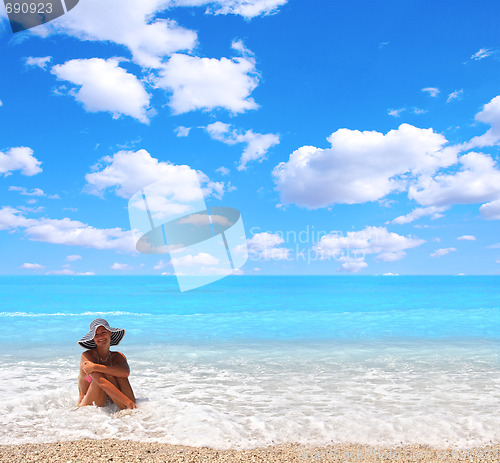 Image of Woman enjoying the sea