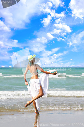 Image of Woman enjoying the sea
