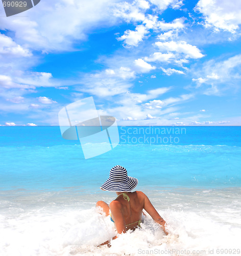 Image of Woman enjoying the sea