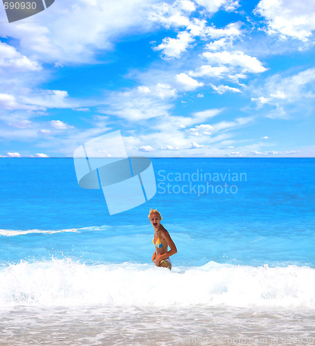 Image of Woman enjoying the sea