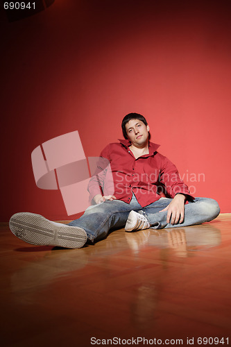 Image of sexy young man on red background