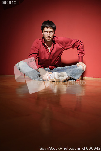 Image of sexy young man on red background