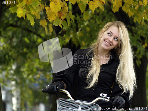 Image of Young woman on bicylce