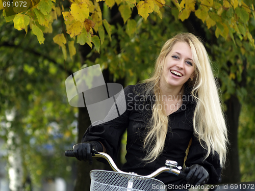 Image of Young woman on bicylce