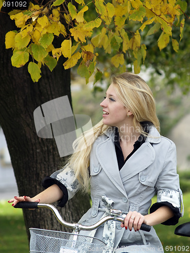Image of Young woman on bicylce