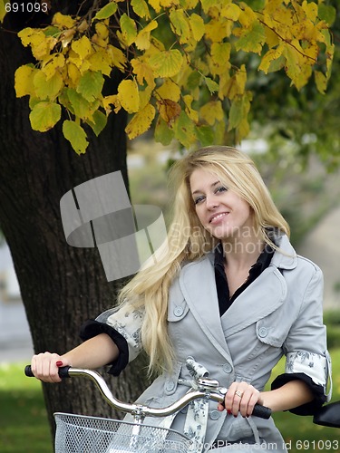 Image of Young woman on bicylce