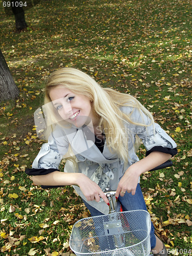 Image of Young woman on bicylce