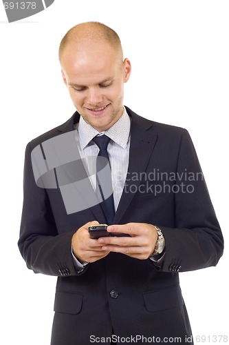 Image of Young happy man holding mobile phone