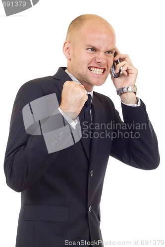 Image of happy young businessman on cell phone