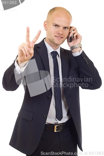 Image of businessman on the phone making his victory sign