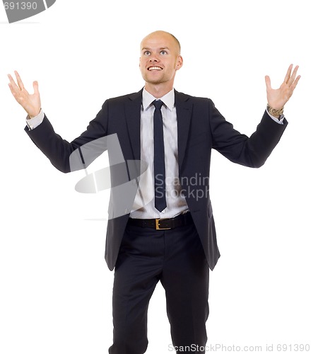 Image of energetic businessman with his arms raised