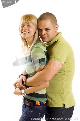 Image of Young couple cuddling happily in love