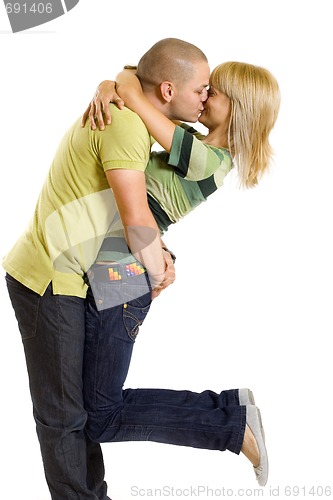 Image of young man kissing his girlfriend in the air