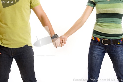 Image of young couple holding hands