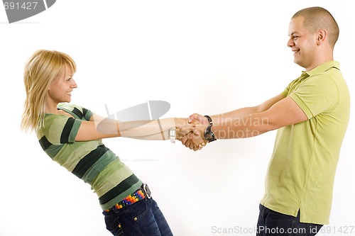 Image of happy young couple holding by hands