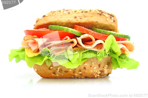 Image of Fresh sandwich with ham and cheese and vegetables