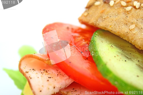 Image of Fresh sandwich with ham and cheese and vegetables