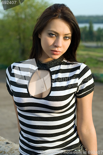 Image of Portrait of the sexy young woman outdoors