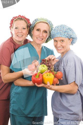 Image of group of nurses with healthy fruits and vegetables