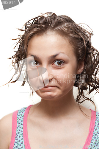 Image of Young girl with wet hair, make faces