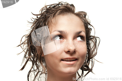 Image of Beautiful girl with wet hair looks upwards