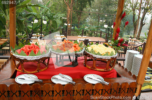 Image of Wooden table, papaya, watermelon, pineapple