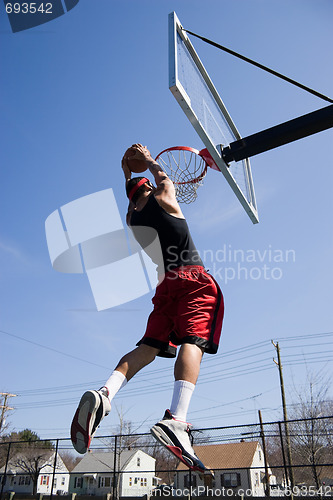 Image of Man Dunking the Basketball