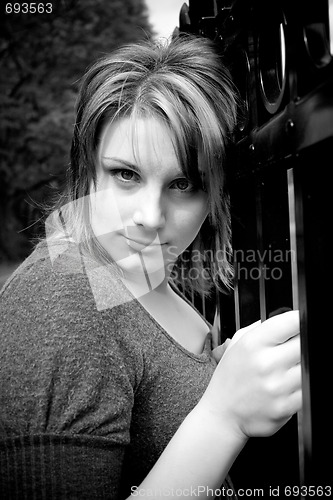 Image of Woman by the Fence