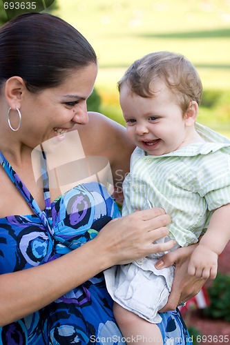 Image of Happy Mother Holding Her Baby