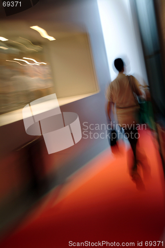 Image of Woman walking indoor