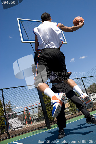 Image of Men Playing Basketball