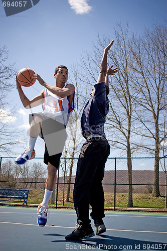 Image of Men Playing Basketball