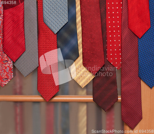 Image of Male ties hung on door