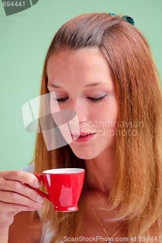 Image of Redhead drinking coffee