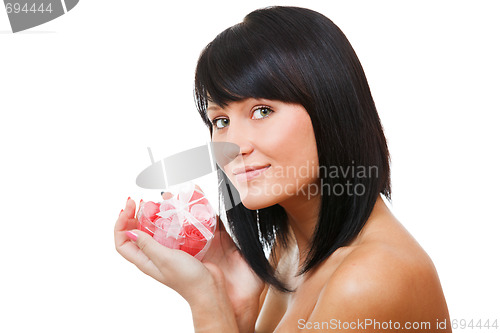 Image of Sexy brunette holding gift-box