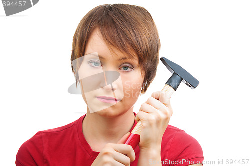 Image of Sad woman with  hammer