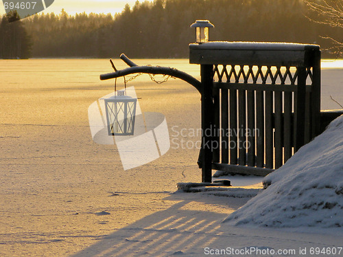 Image of  Lantern in the afternoon on the icy lake 