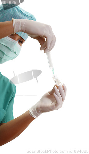 Image of Hands filling a syringe