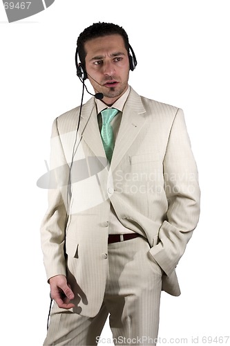 Image of Businessman closing a deal on the headset phone