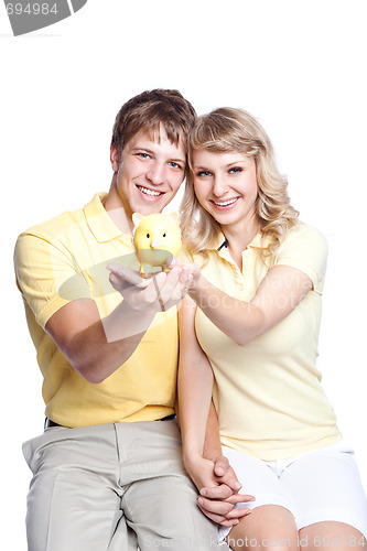 Image of Young couple saving money