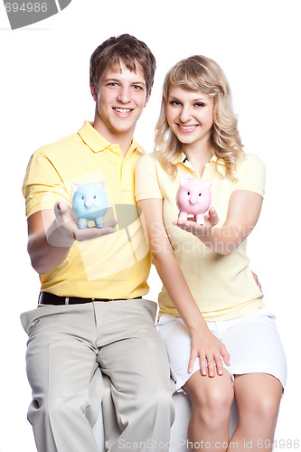 Image of Young couple saving money