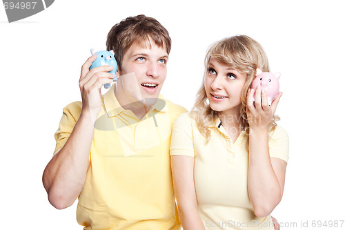 Image of Young couple saving money