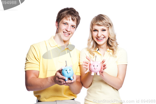 Image of Young couple saving money