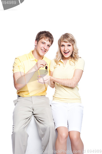 Image of Young couple holding a set of keys