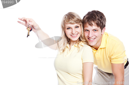 Image of Young couple holding a set of keys