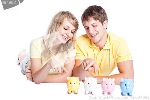 Image of Young couple saving money