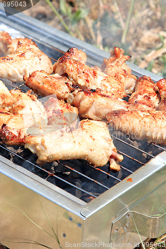 Image of BBQ. Close up photo of cooking meet on the open fire